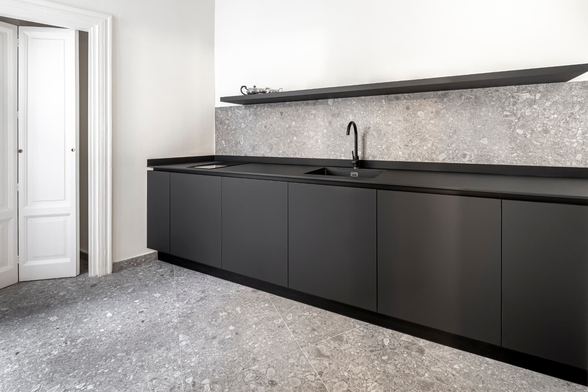Custom marble kitchen integrated into a refined residence